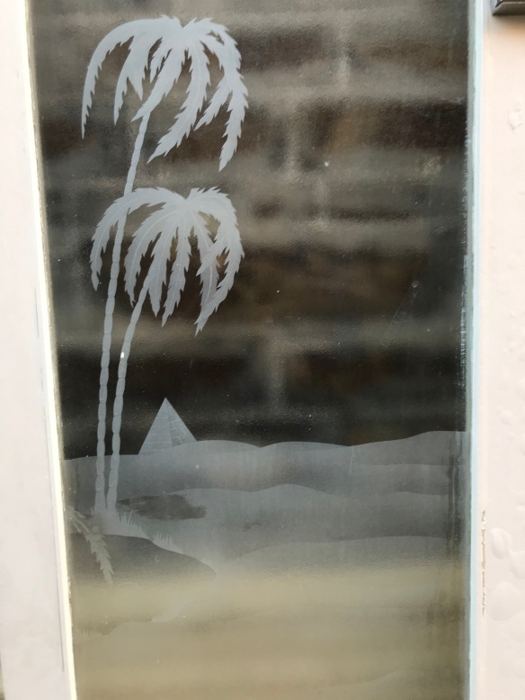Detail on pair of external French doors with palm trees, camel and pyramid etching , 2025 mm tall x 1525 mm wide , $695