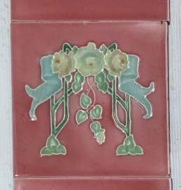 Pilkington Tile Co. England. Unusual feature tile with flowers and ribbon, pale blue, yellow and greens on mid pink glaze. (OTB309) Price for the two panel set $260 salvaged vintage recycled, demolition, reproduction, restoration, home renovation secondhand, used , original, old, reclaimed, heritage, antique, victorian, art nouveau edwardian georgian art deco