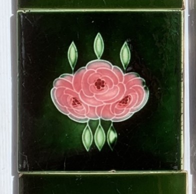 Detail of T&R Boote, England feature tiles, circa 1915. trio of mid pink flowers on deep rich green background. with 2 x 6 inch original spacer tiles. some light scratches. Two panel fireplace set, $335 (OTB324) salvaged, recycled, demolition, reproduction, restoration, home renovation secondhand, used , original, old, reclaimed, heritage, antique, victorian, art nouveau edwardian, georgian, art deco
