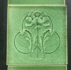 salvaged vintage recycled, demolition, reproduction, restoration, home renovation secondhand, used , original, old, reclaimed, heritage, antique, victorian, art nouveau edwardian georgian art deco Detail of T&R Boote, England, c1905 Art Nouveau moulded feature tiles, flower and foliage in apple green glaze. Two panel fireplace set $284 for the pair (OTB317)